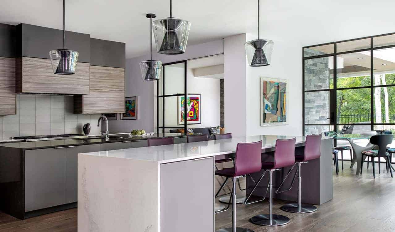 A contemporary kitchen in Memorial Houston with Troy Lighting pendants