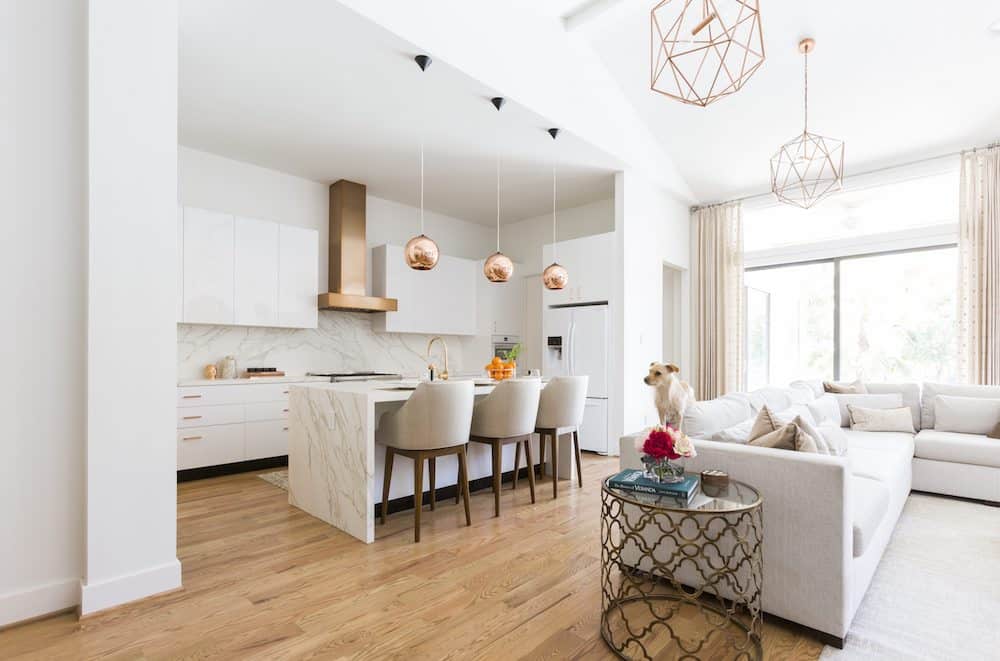 Abundant lighting from gold-colored hanging pendants brightens this contemporary space 