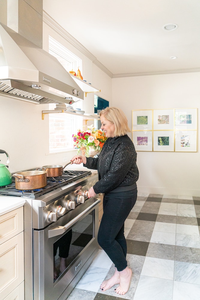 Laura Umansky at home using her Monogram Appliance range and oven